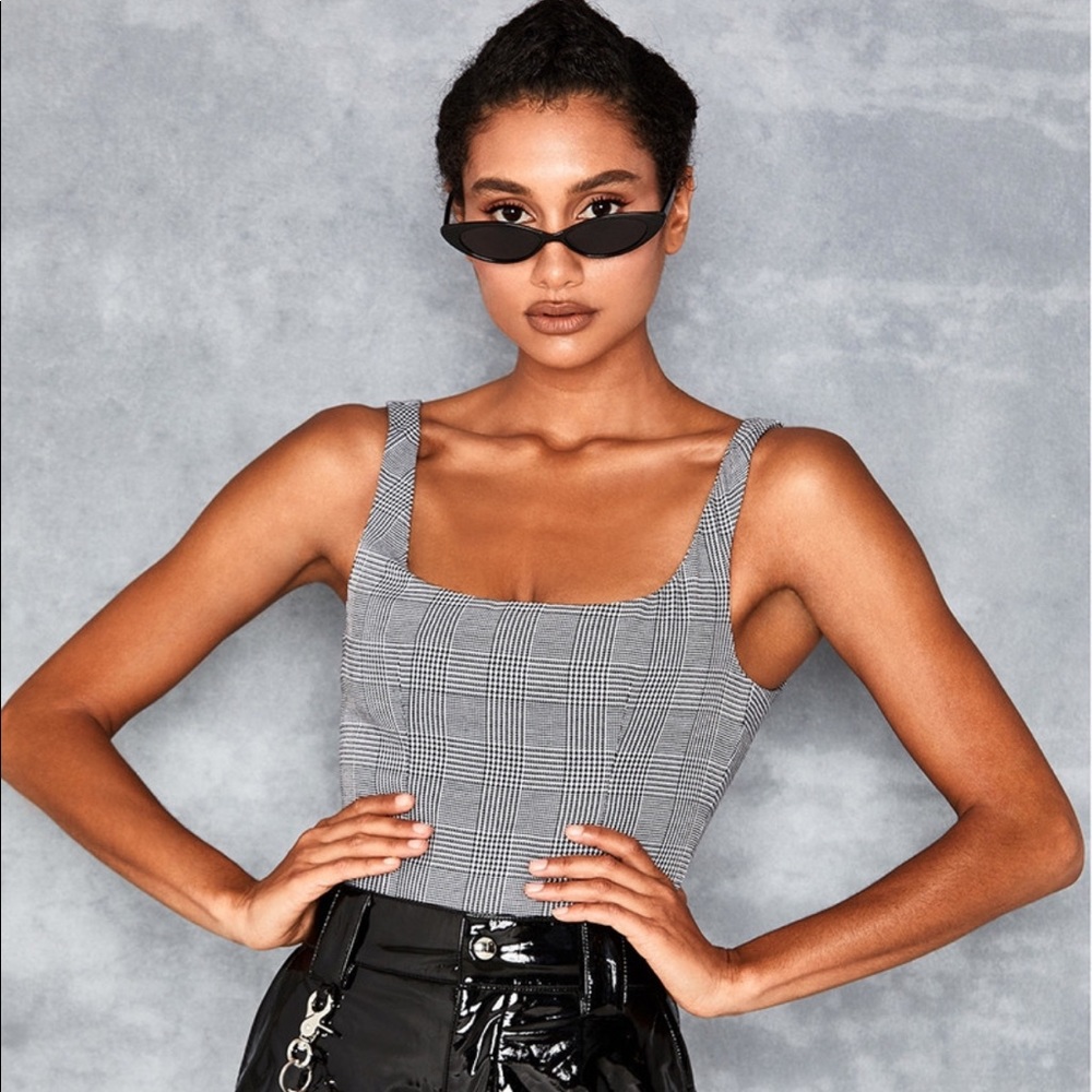 Mistress rocks black and white checked bodysuit